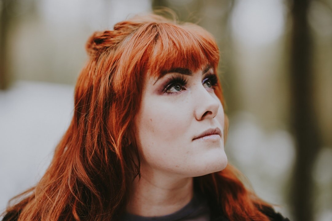 woman with short red hair at event