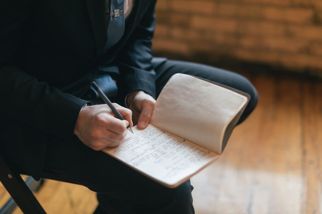 musician writing in notebook