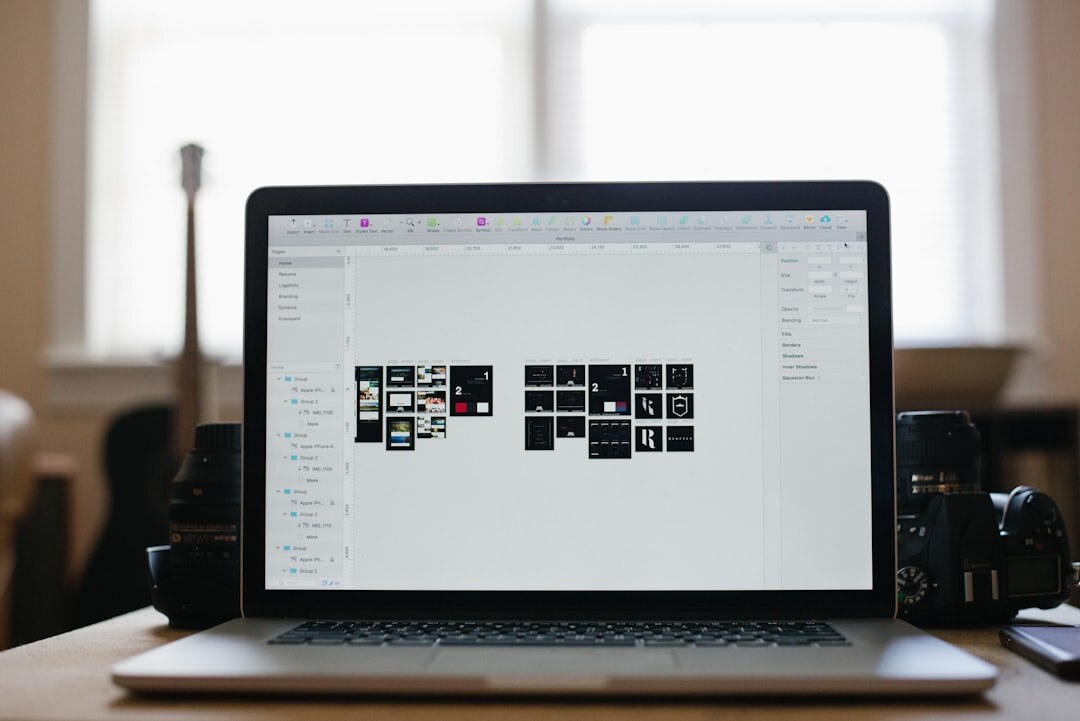 Journalist editing photos on a laptop at a desk