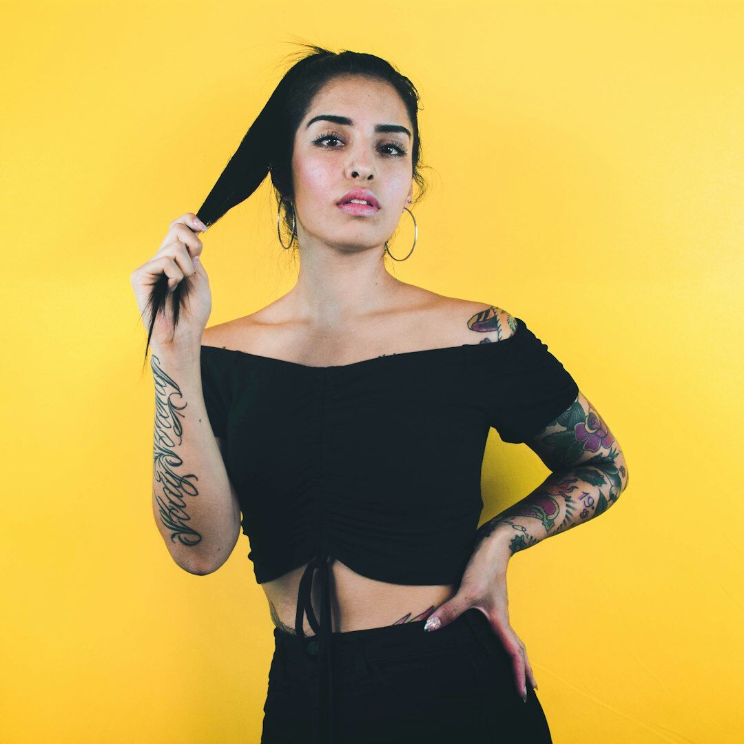 Studio portrait of a young Latina woman with straight hair